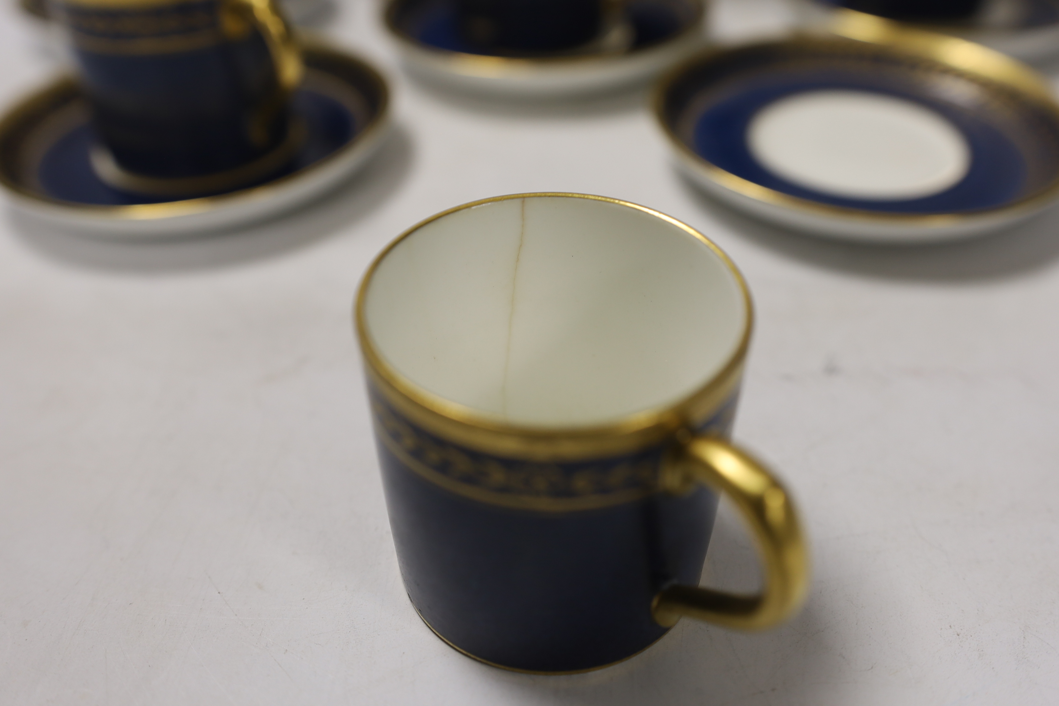 A Mintons powder blue part coffee set comprising six cans and saucers, coffee pot and milk jug together with a Staffordshire flat back figure group, 20cm wide